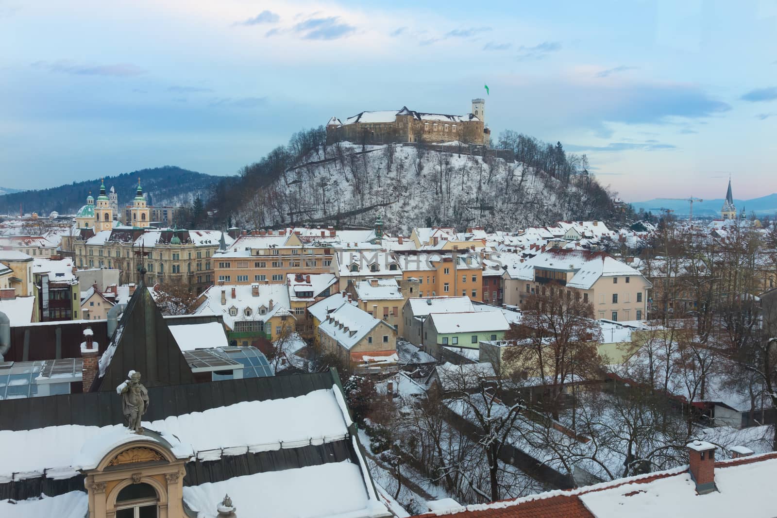 Panoramic view of Ljubljana, capital of Slovenia. Roofs covered in snow in winter time.