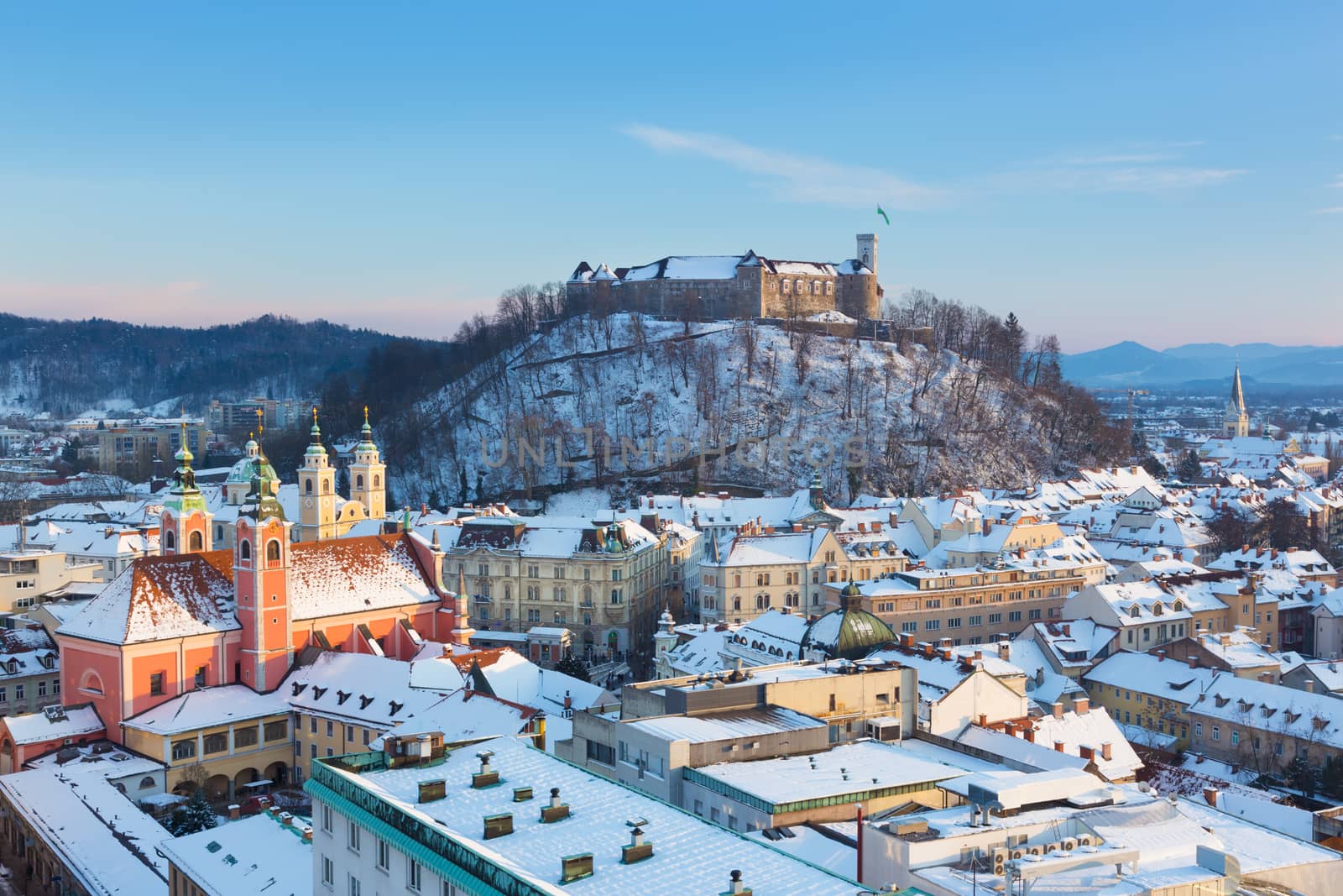 Panoramic view of Ljubljana, capital of Slovenia. Roofs covered in snow in winter time.