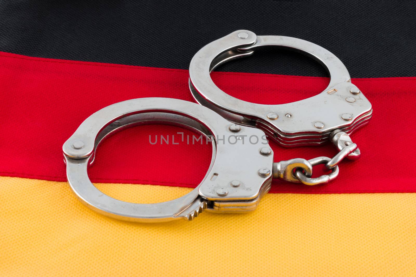 Handcuffs with signs of usage on German flag