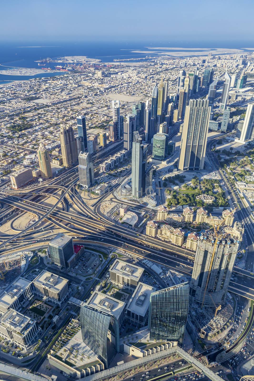 Vertical view of Dubai city from the top of a tower.