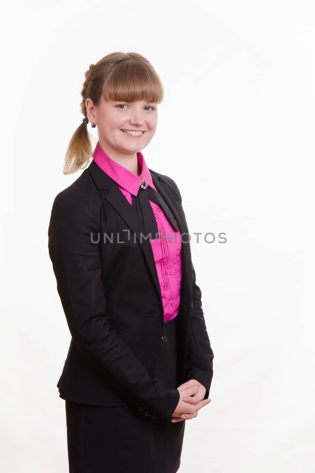 Portrait of a young girl in a suit