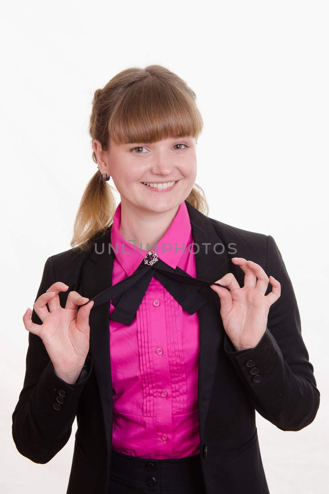 Portrait of a young girl in a suit