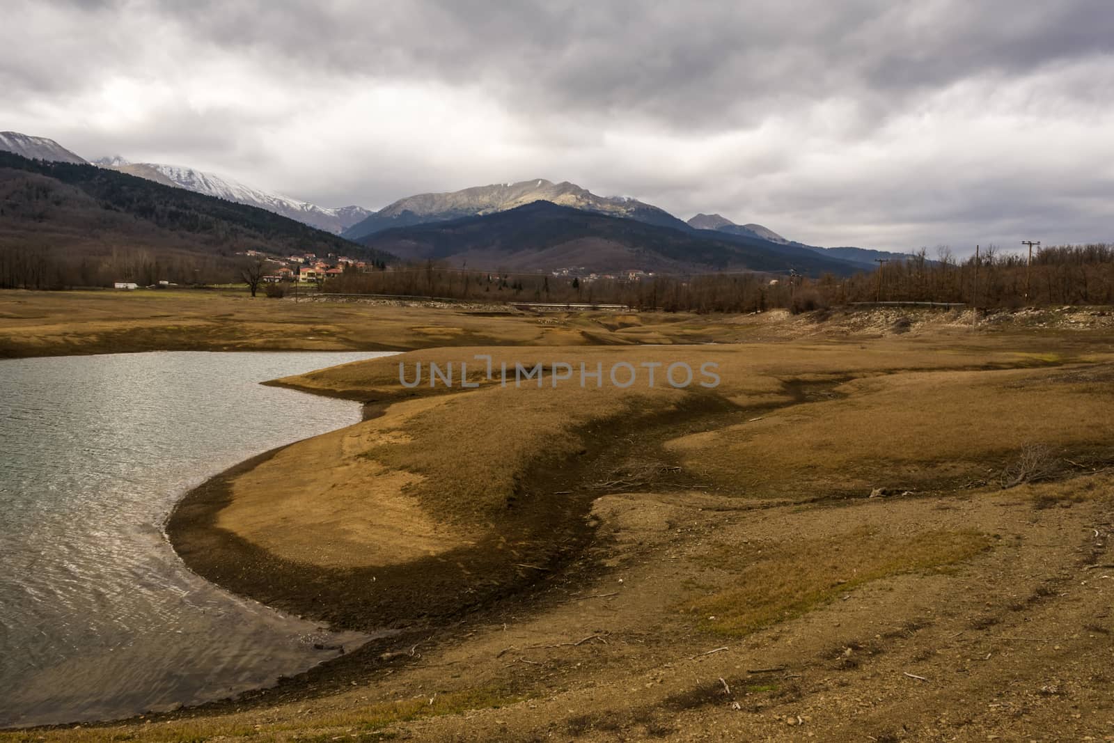 Plastiras lake view with dramatic cloudy sky, in central Greece