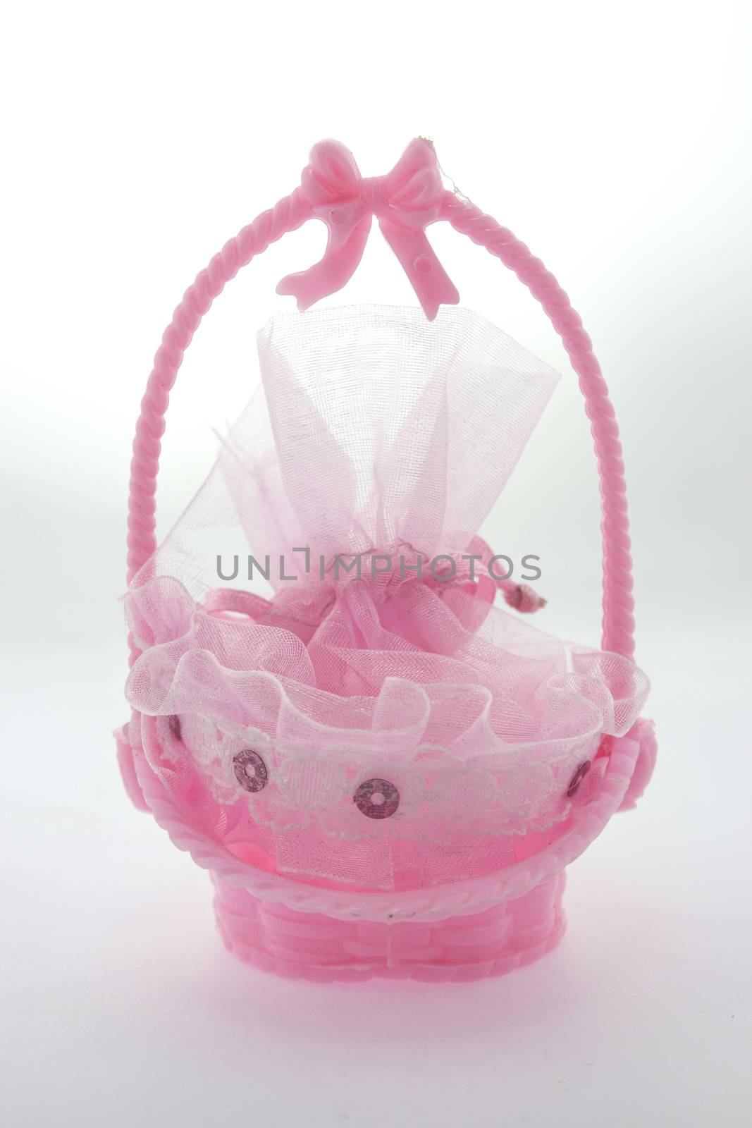 baby girl souvenir�� Small pink plastic basket for candy.