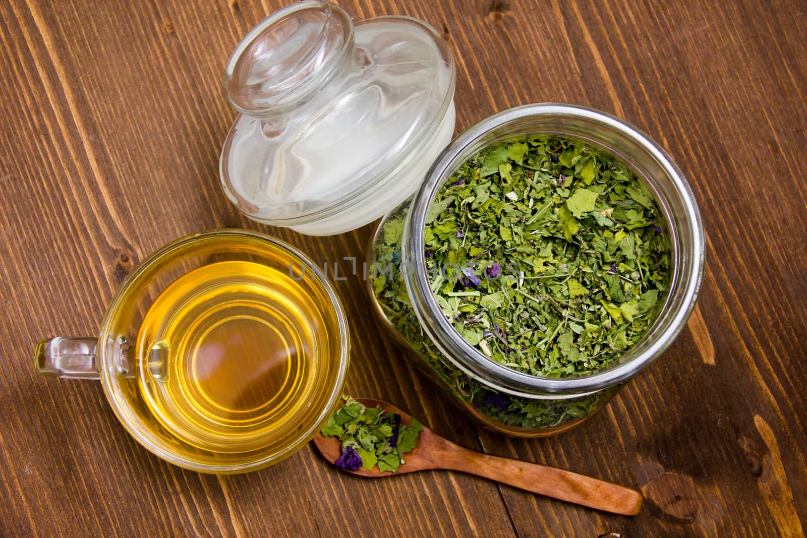 Tisane mauve inside cup on wooden table top view