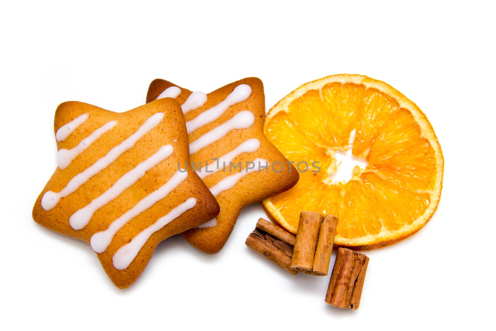 Christmas cookies with orange and cinnamon on white background