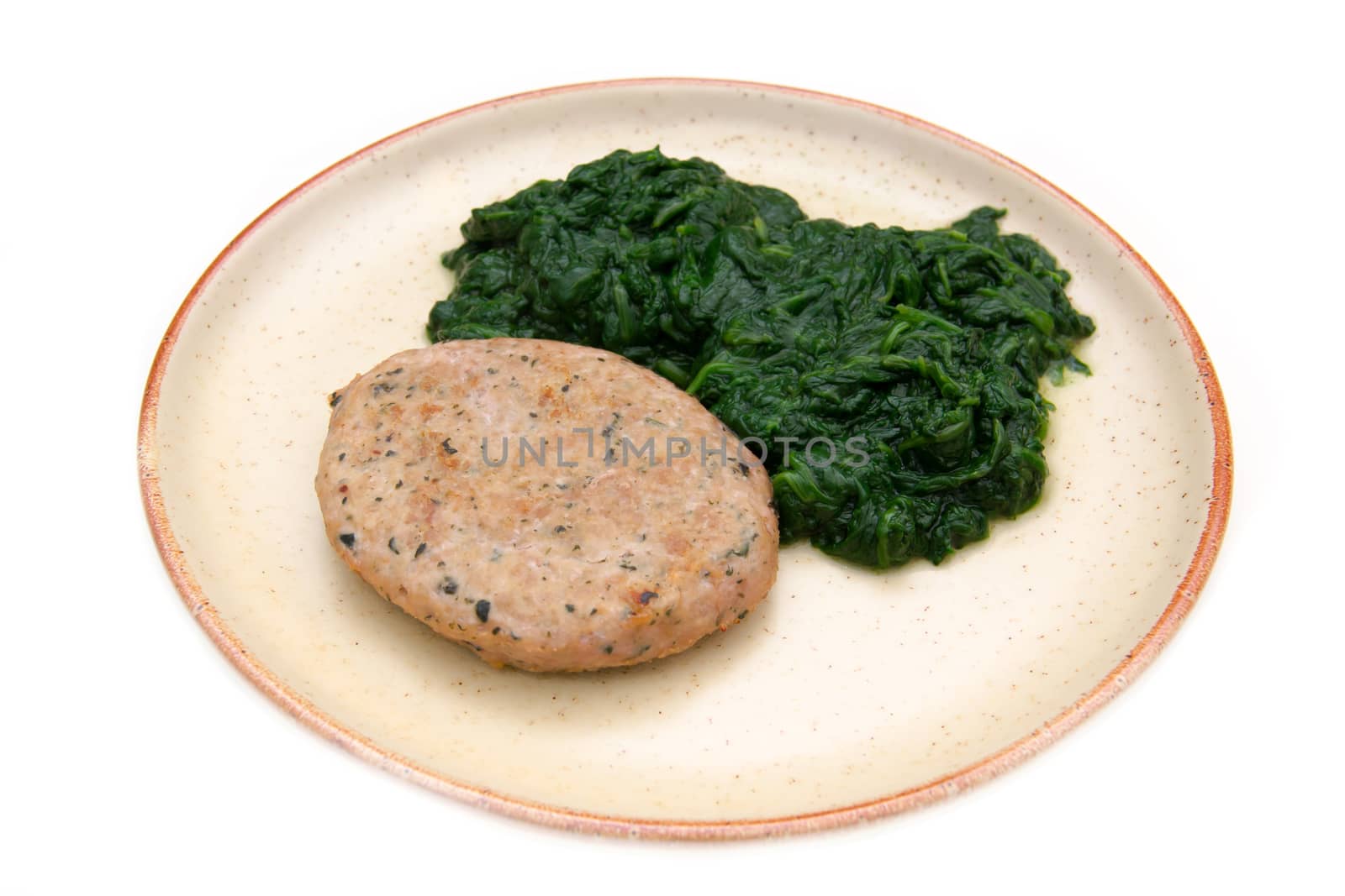 Hamburger meat with spinach on white background