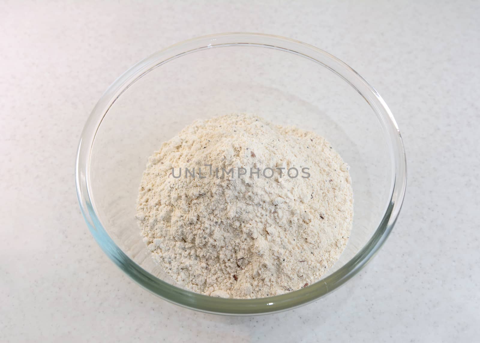 Malted bread flour mix with mixed seeds in a glass bowl