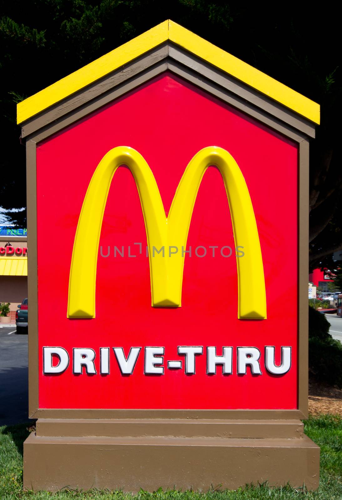 SAND CITY, CA/USA - JULY 15, 2014: McDonald's Drive-Thru sign. The McDonald's Corporation is the world's largest chain of hamburger fast food restaurants.
