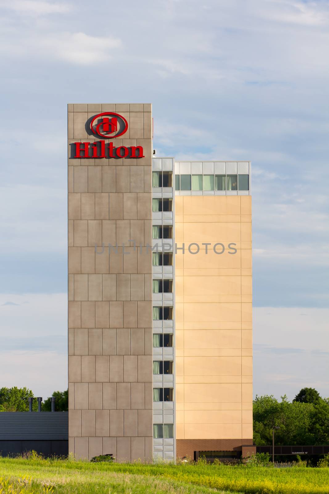 BLOOMINGTON, MN/USA - JUNE 22, 2014: Hilton hotel exterior. Hilton is an international chain of full service hotels and resorts and the flagship brand of Hilton Worldwide.