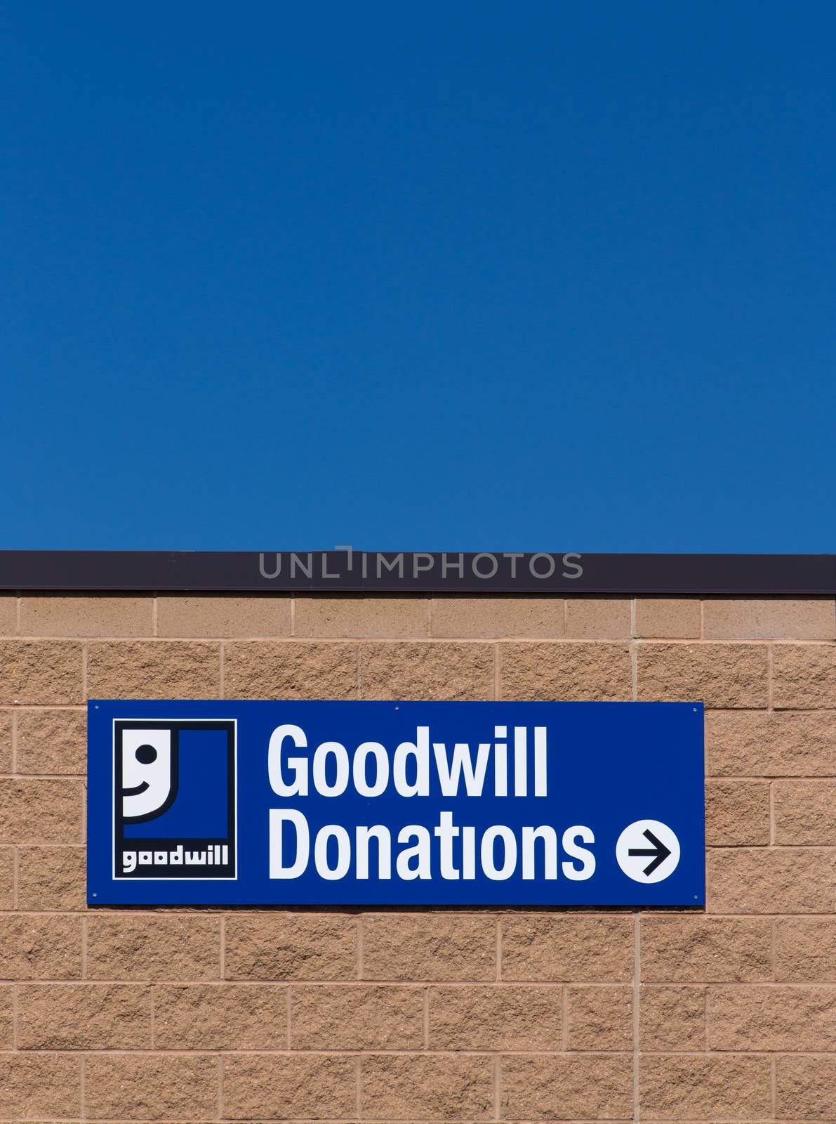 BLOOMINGTON, MN/USA - JUNE 21, 2014:  Goodwill store exterior sign. Goodwill Industries is a nonprofit organization that provides job training programs for people with disabilities.