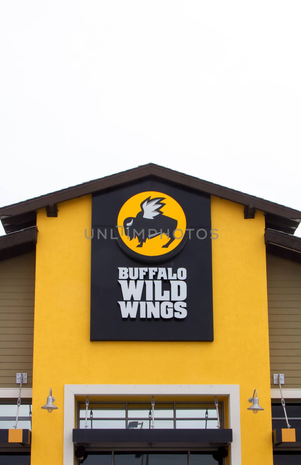 SEASIDE, CA/USA - MAY 8, 2014:  Buffalo Wild Wings restaurant. Buffalo Wild Wings Grill & Bar is a casual dining restaurant and sports bar franchise in the United States and Canada known for its Buffalo wings.