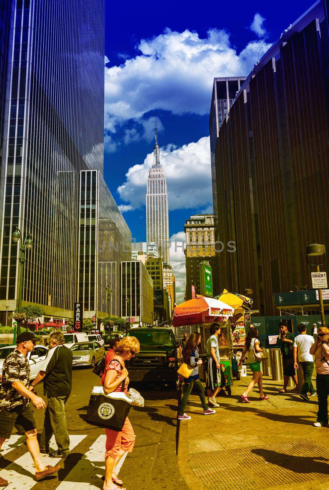 NEW YORK CITY - JUNE 14, 2013: Tourists walk along city streets by jovannig