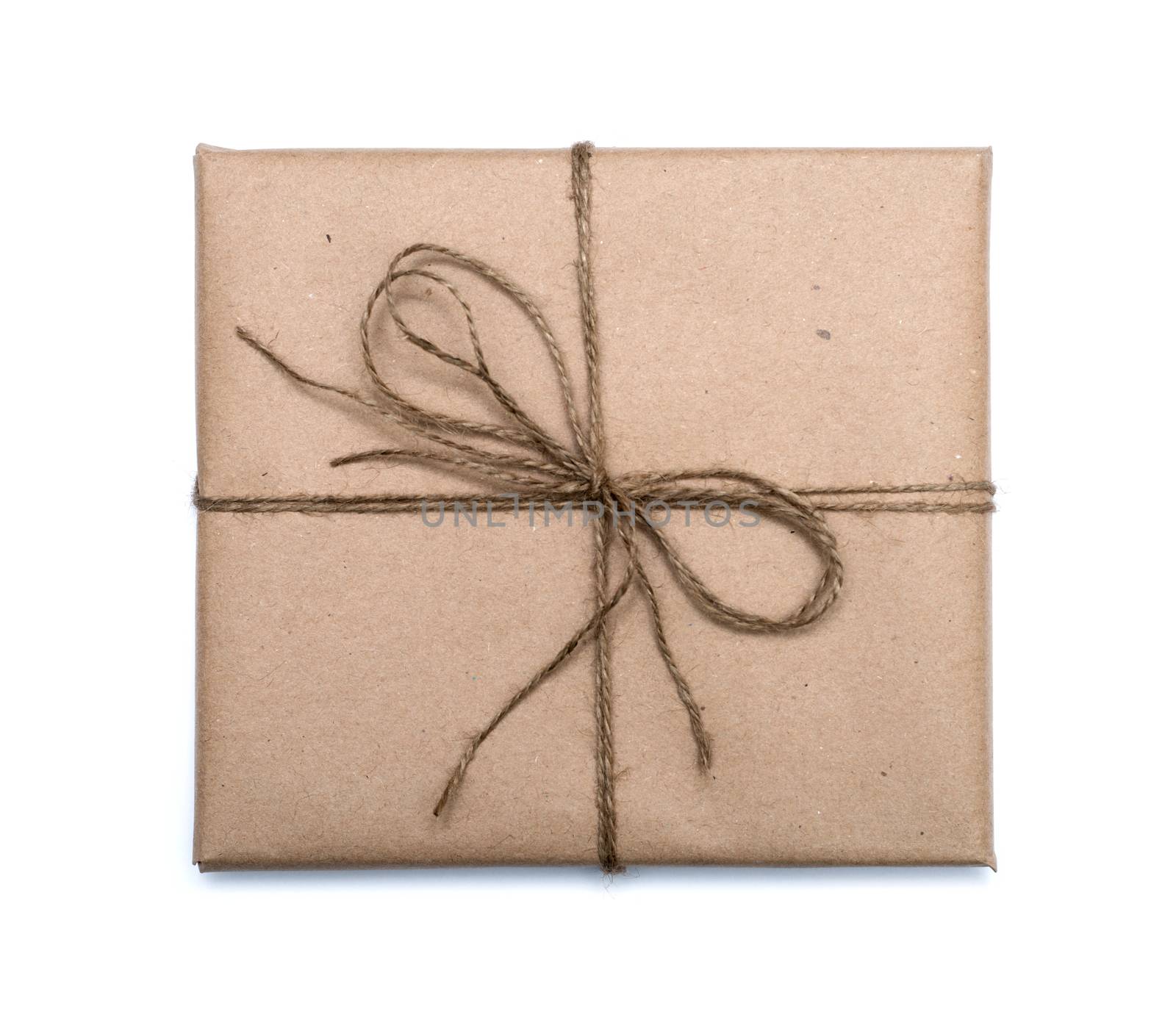 parcel wrapped with brown kraft paper isolated on white backgrou by DNKSTUDIO