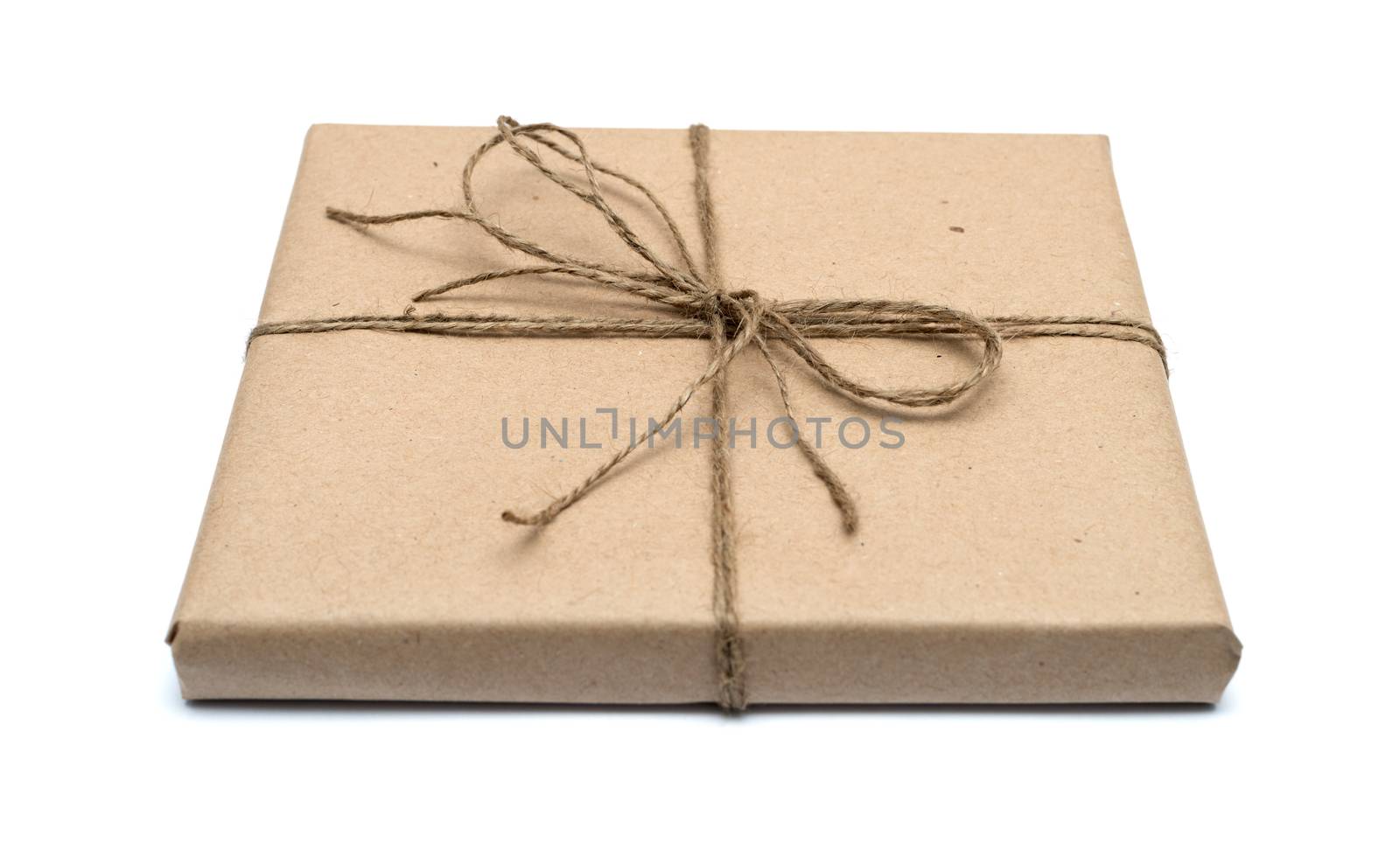 parcel wrapped with brown kraft paper isolated on white background