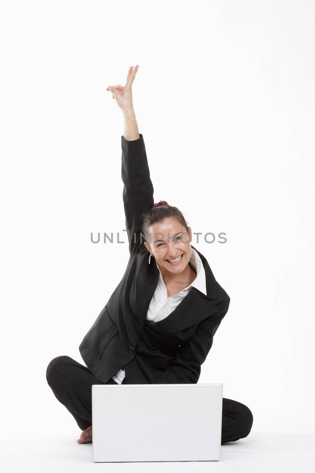 woman with computer cheering by courtyardpix