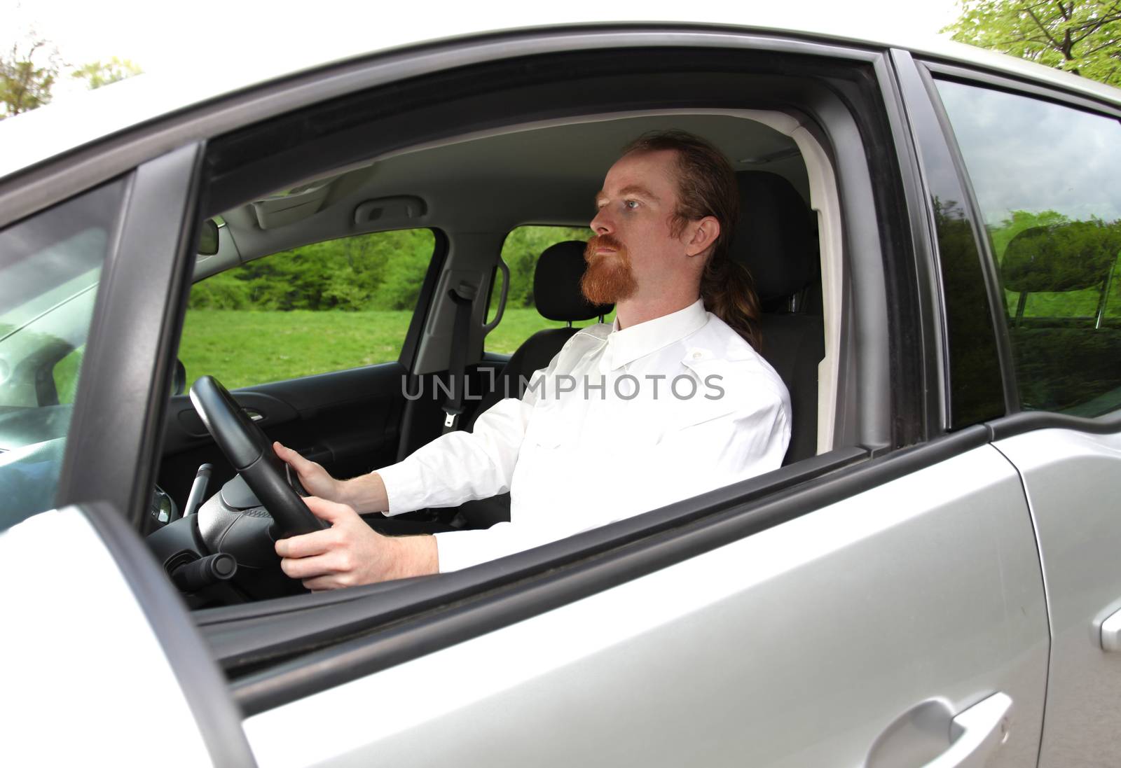 Man driving his car on road