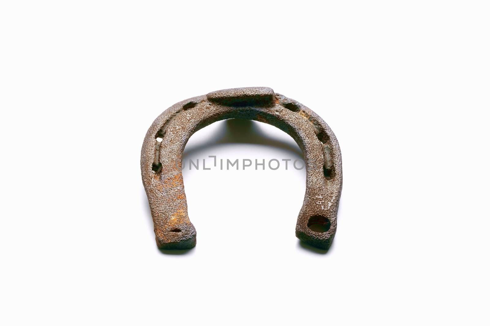 old rusty horseshoe isolated on white background - clipping path