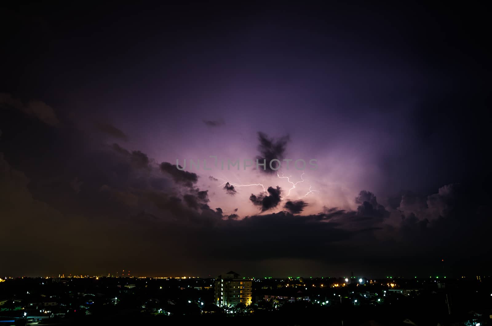 Clouds and thunder lightnings and storm in the city by wanichs