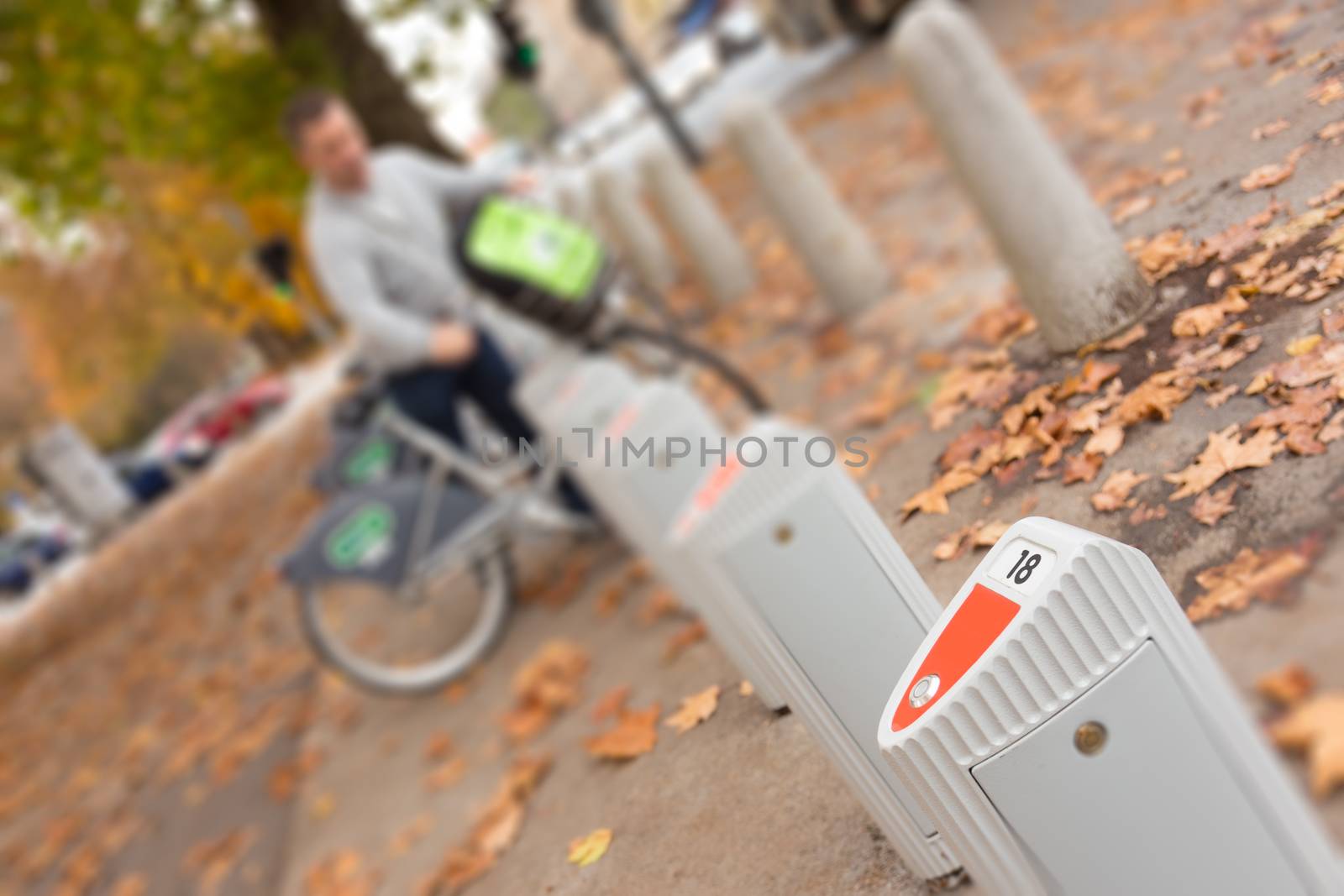 Station of urban bicycles for rent downtown. Green sustainable ecological public transport. Healthy lifestyle.