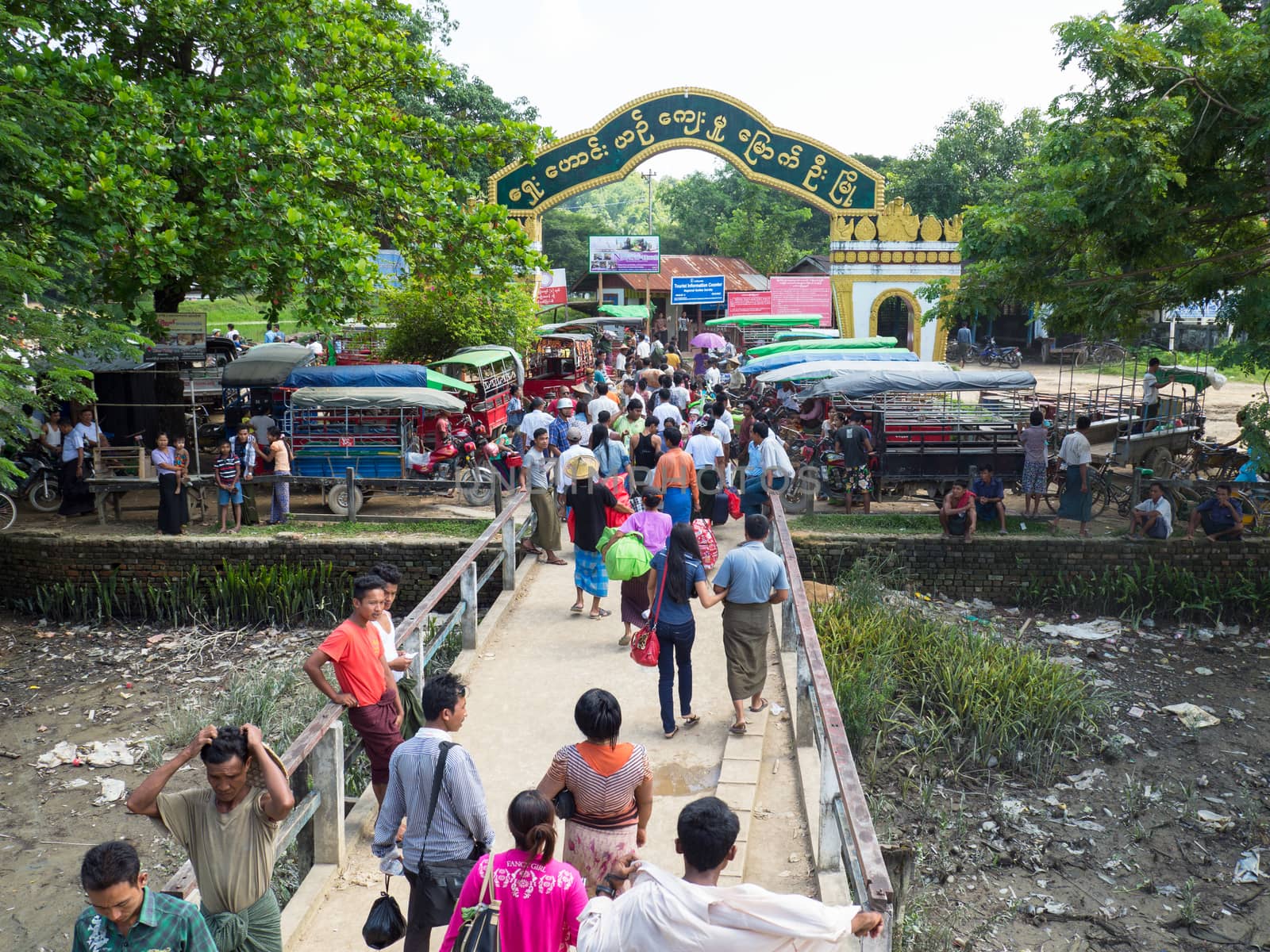 Mrauk U, Rakhin State, Myanmar - October 16, 2014: The ferry pier at the inland town Mrauk U in the Rakhin State, Myanmar during the arrival of the daily boat from Sittwe.