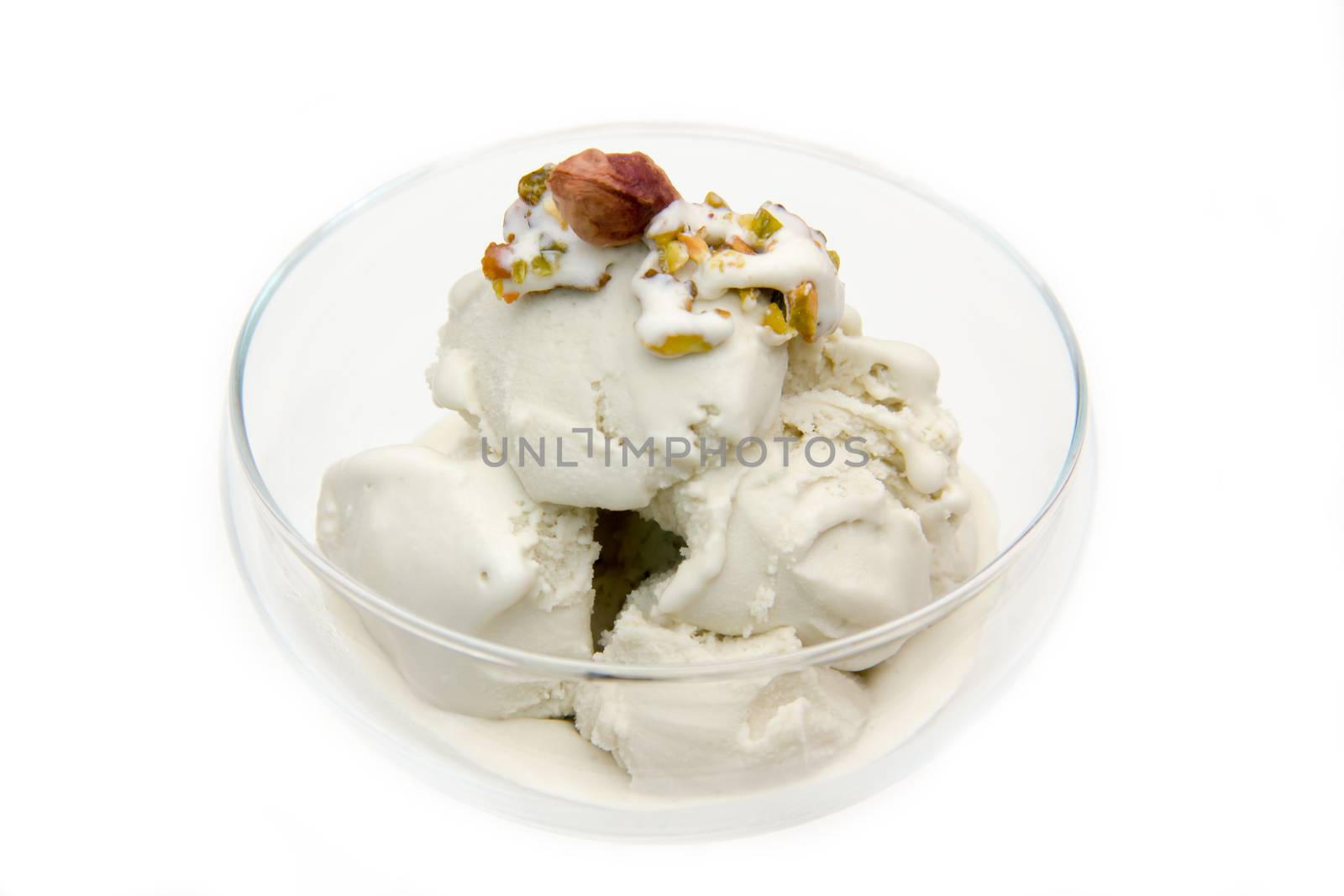 Pistachio ice cream in bowl on white background