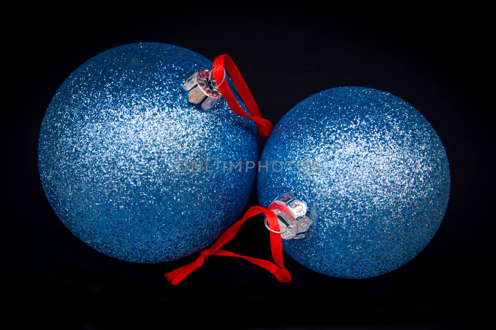 Glittery Christmas balls on a black background