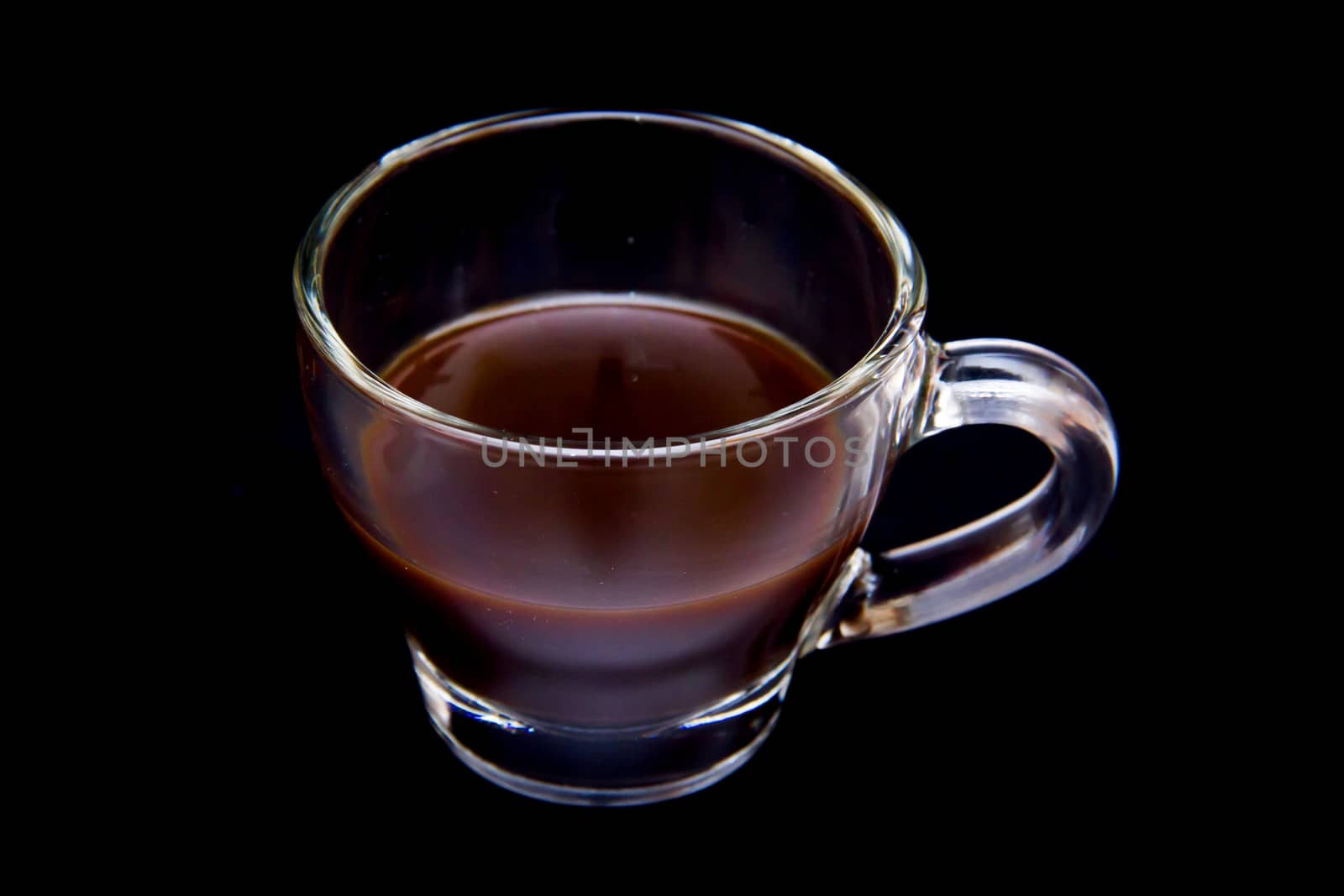 Cup of coffee on black by spafra