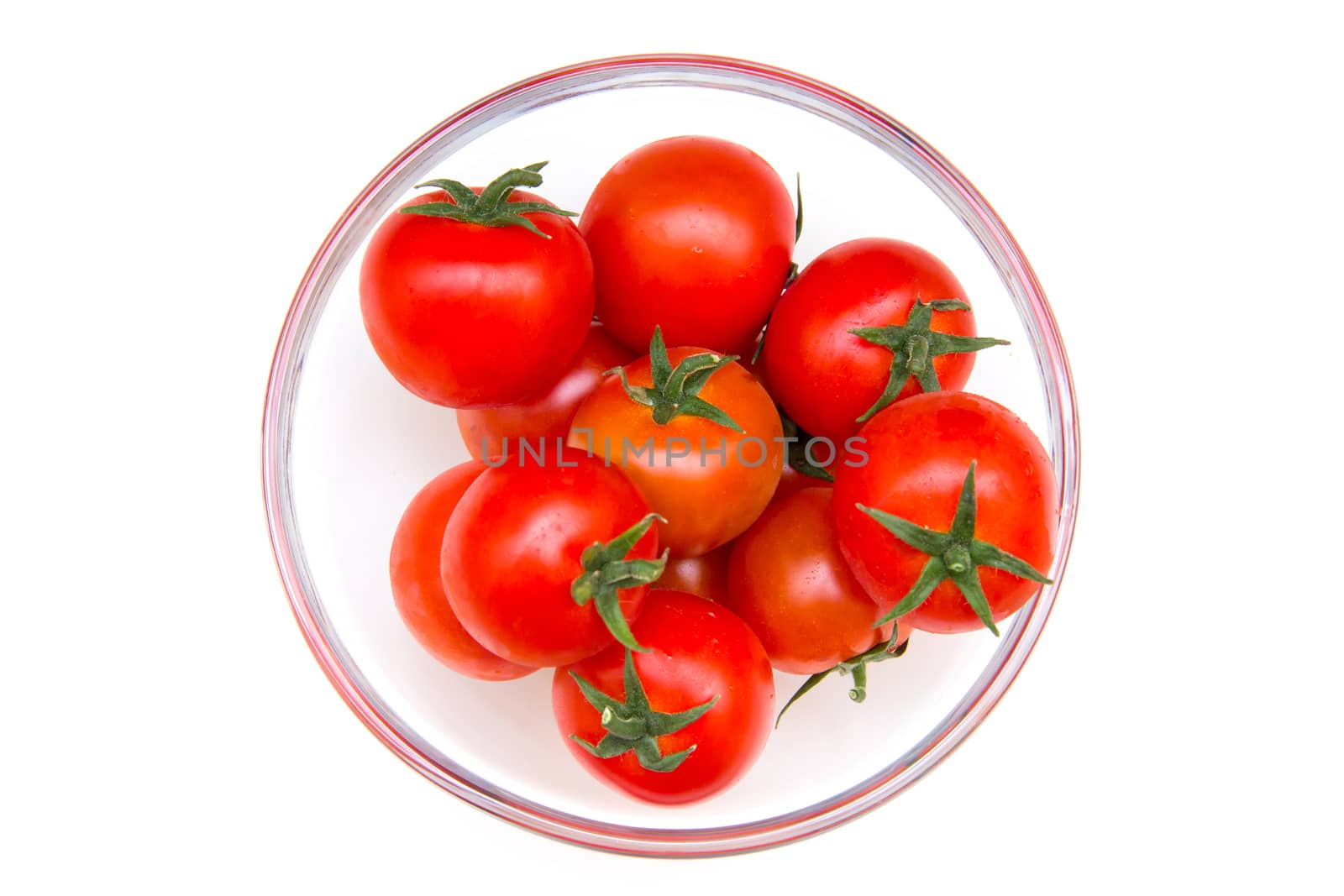 Tomato on bowl on white background seen from above