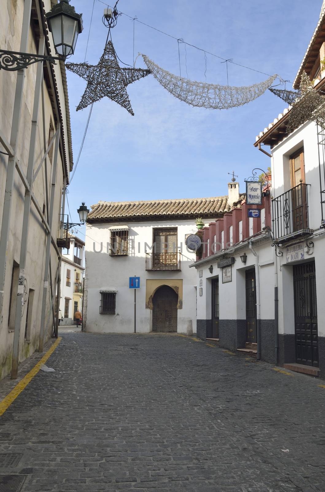 Christmas decoration in a street of the Albaycin, a district of Granada, in Andalusia, Spain, that retains the narrow winding streets of its Medieval Moorish past. 
