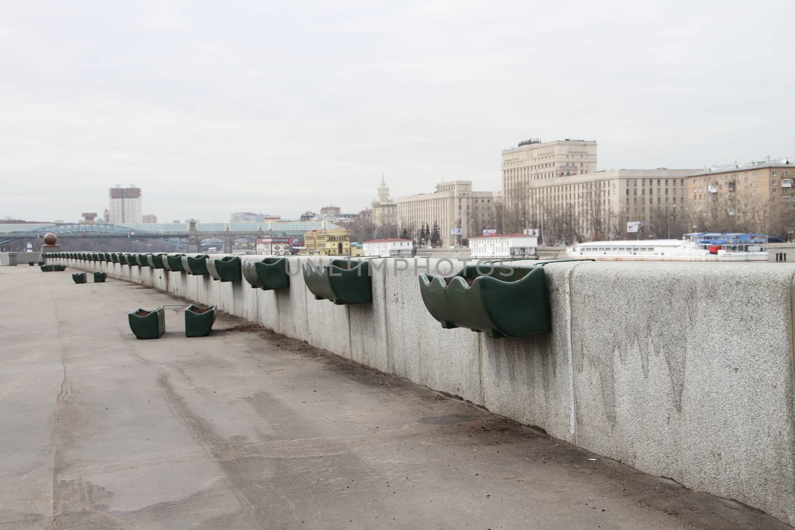 Moscow, Russia - April 19, 2012. In the spring the park prepares for reception of visitors, works on decoration of park are conducted. Flower pots on the embankment in Gorky Park, Moscow