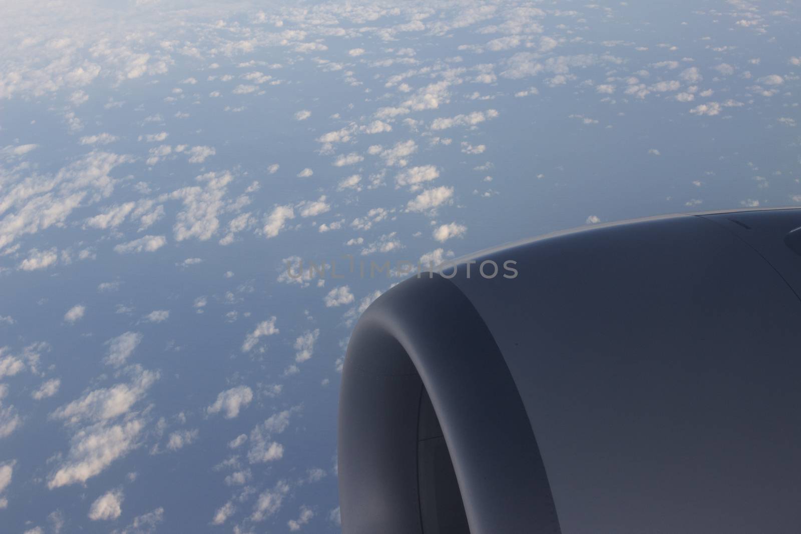 Airplane flying in sky engine wing by edwardolive
