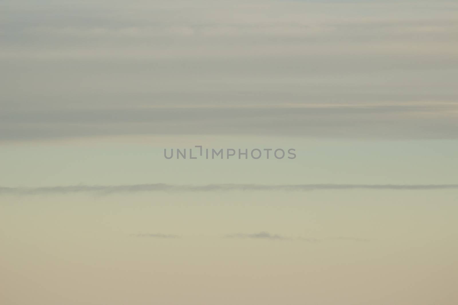 Blue sky with clouds seen from plane window by edwardolive