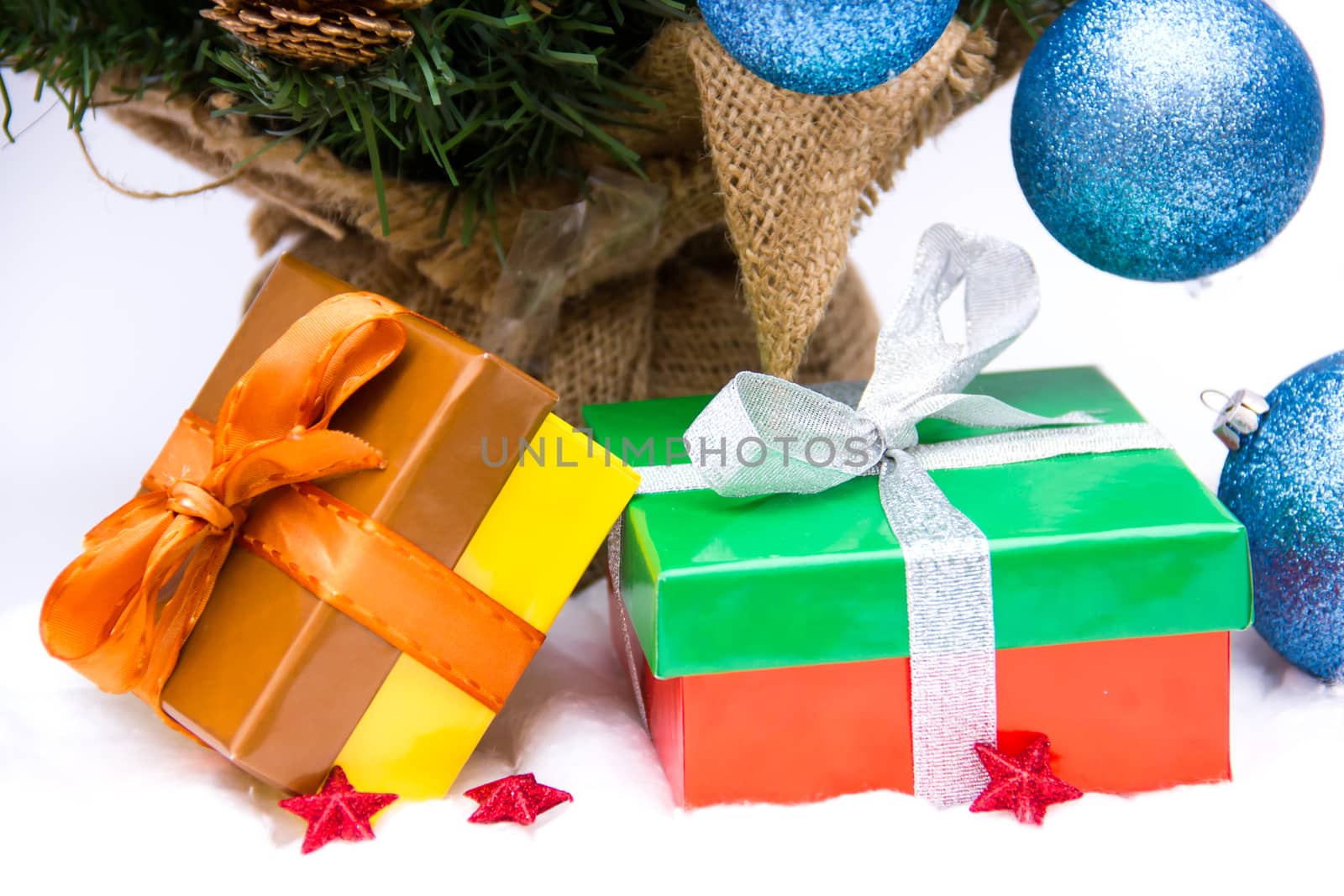 Christmas presents under the tree on a white background
