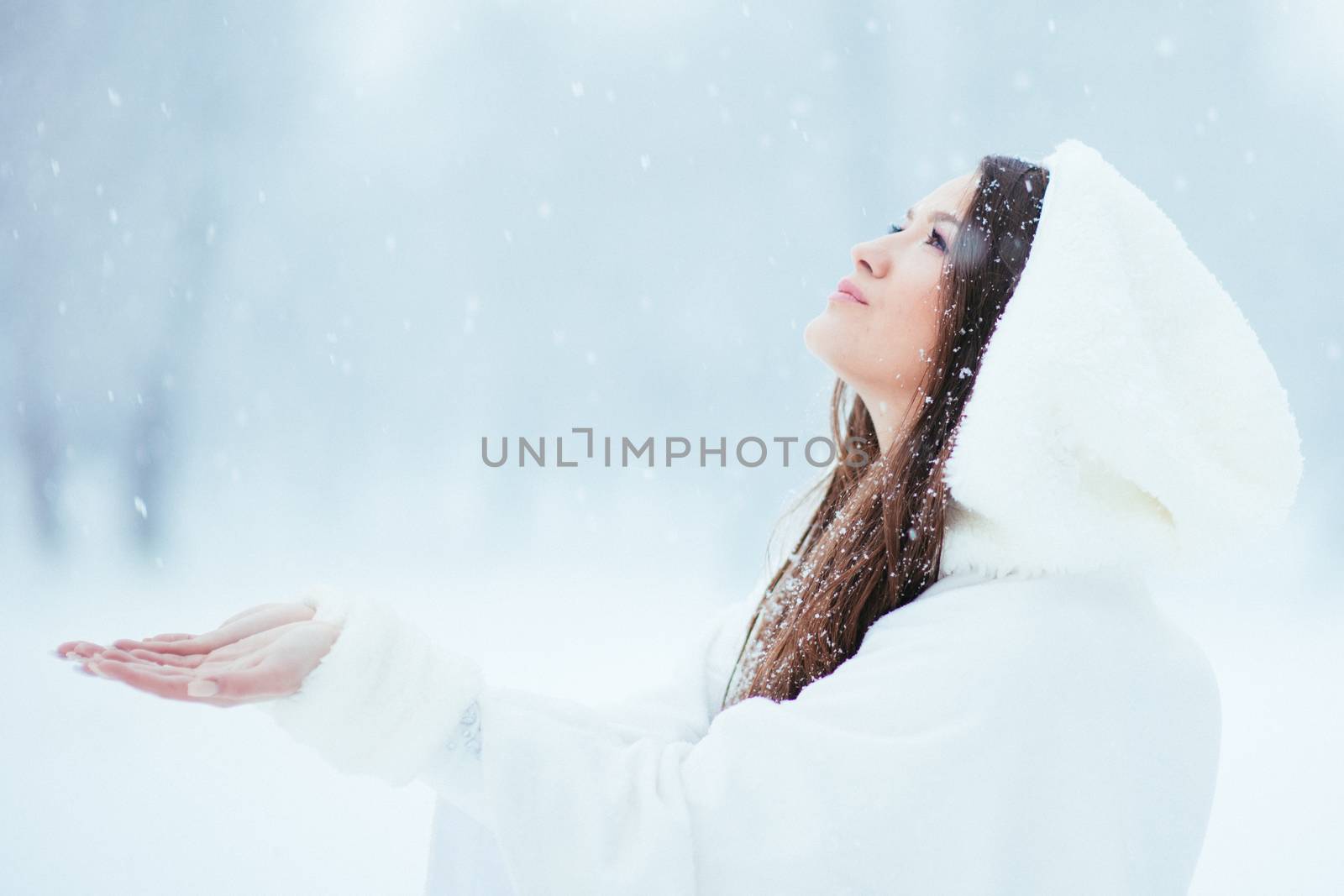 Girl collecting snowflakes by gorgev