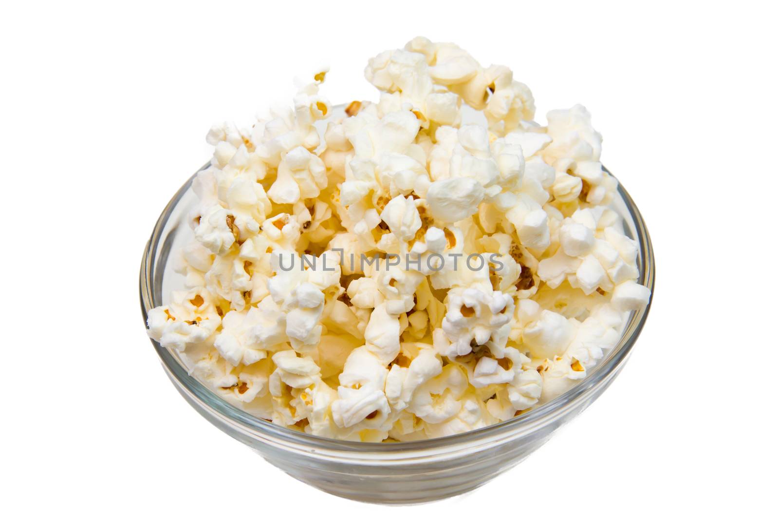 Popcorn on glass bowl on white background
