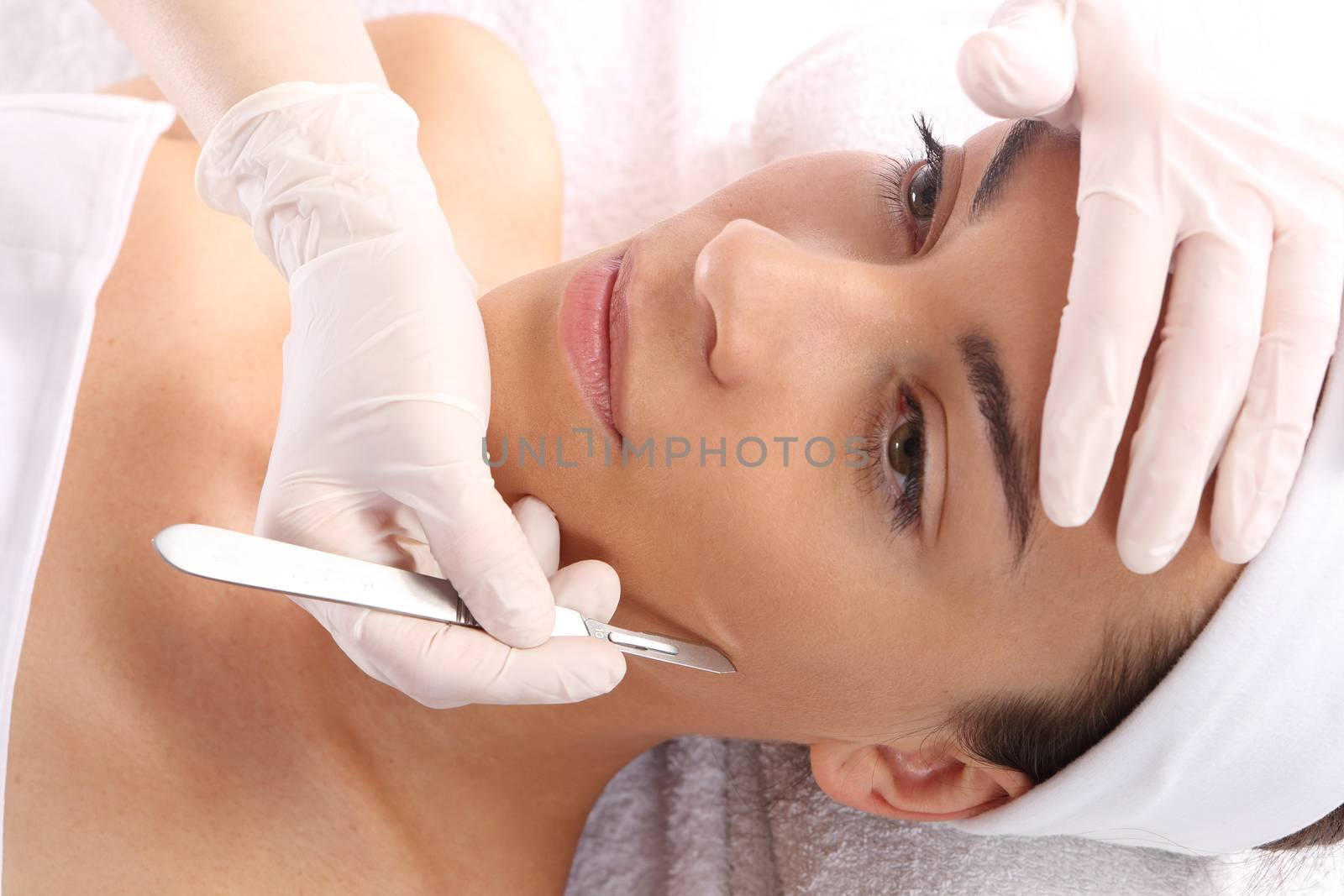 Plastic surgery, a woman in the clinic of aesthetic surgery by robert_przybysz