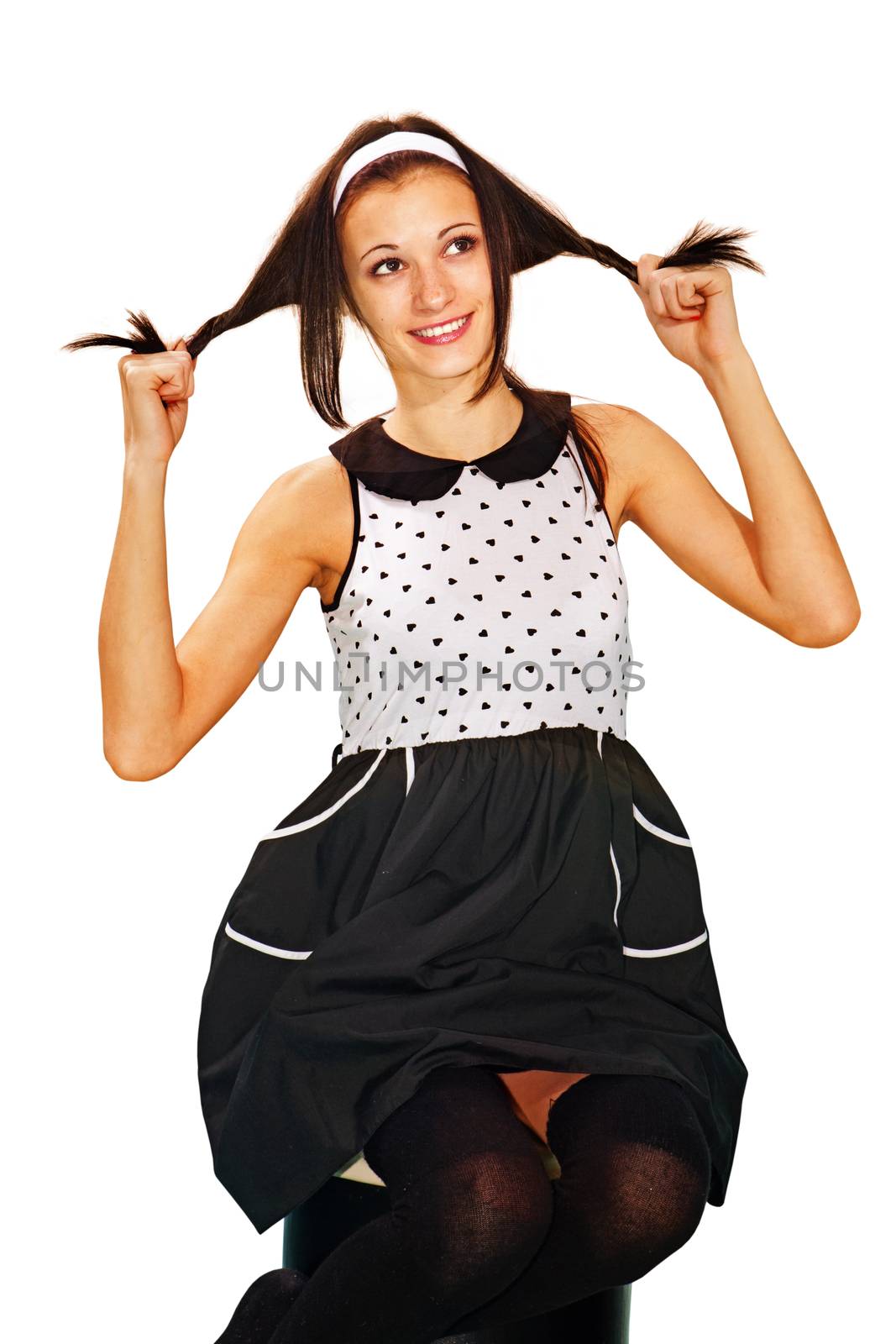 kooky girl plays fool with her hair on white background