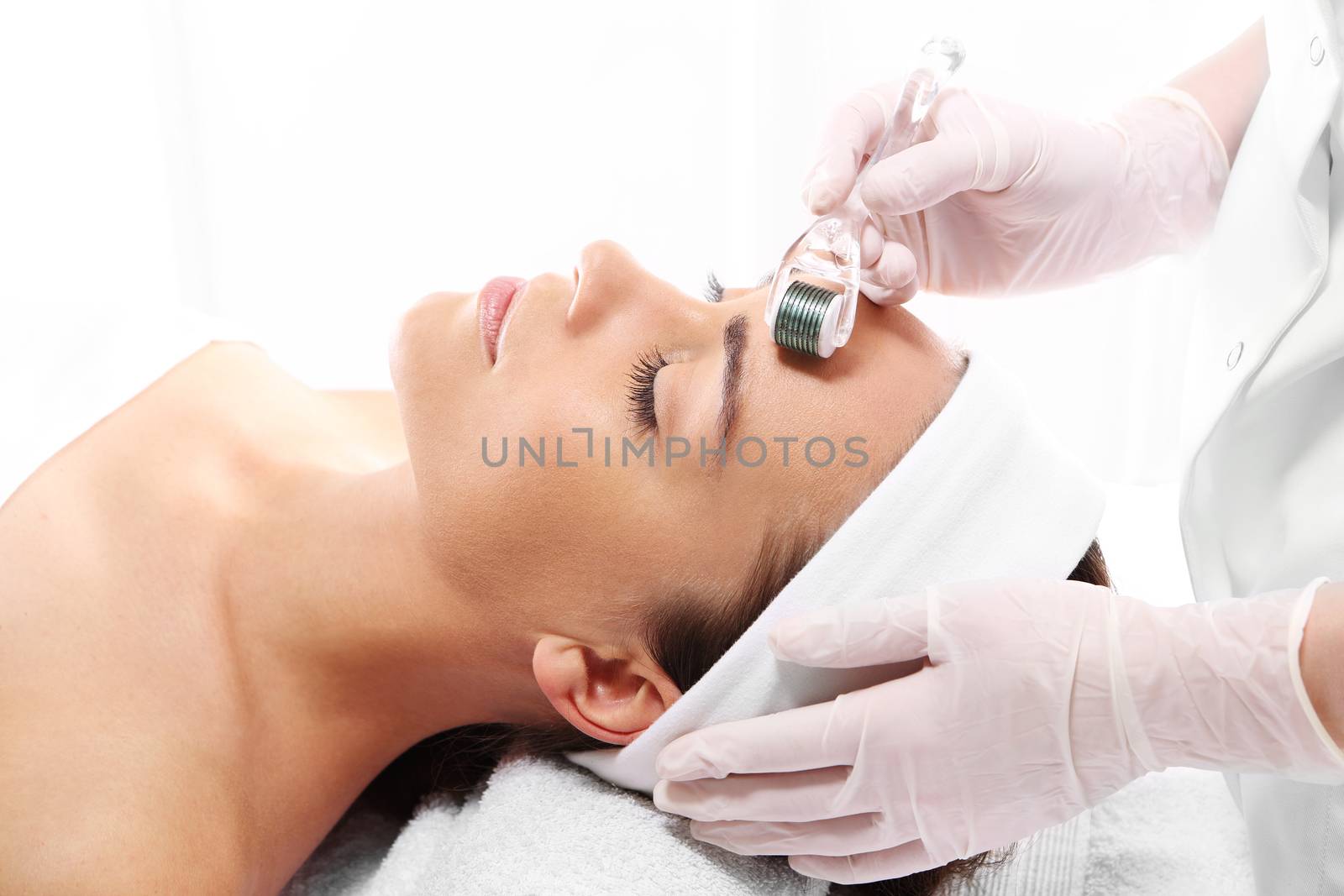 Rejuvenation, beautification, the woman at the beautician, Mesotherapy microneedle