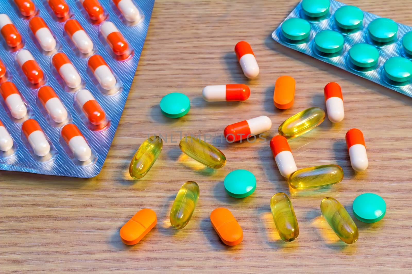 Medications for the treatment of various diseases: a variety of tablets and capsules.