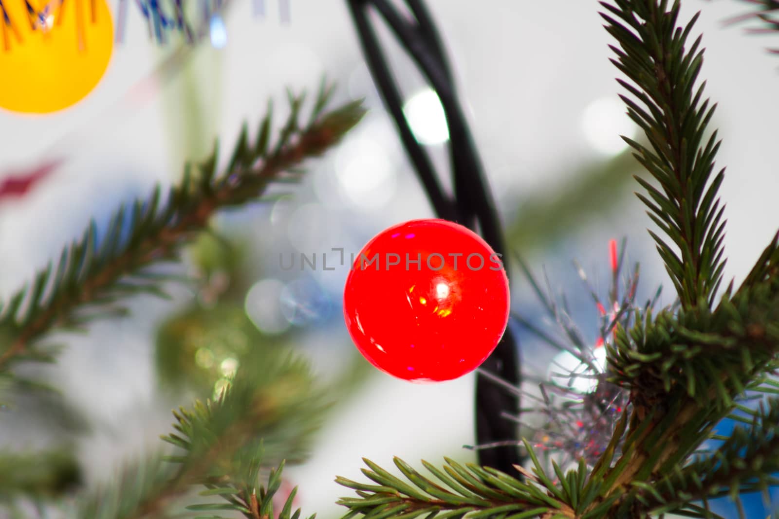 Bright garland on a Christmas tree abstract festive background, colorful