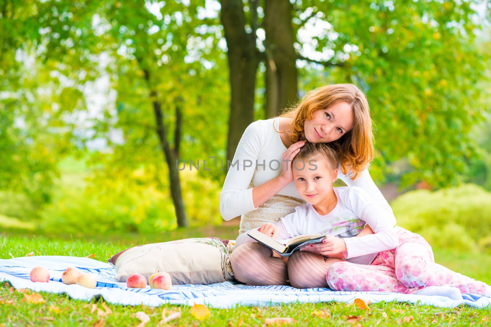 Shooting mother and daughter in the park on a picnic