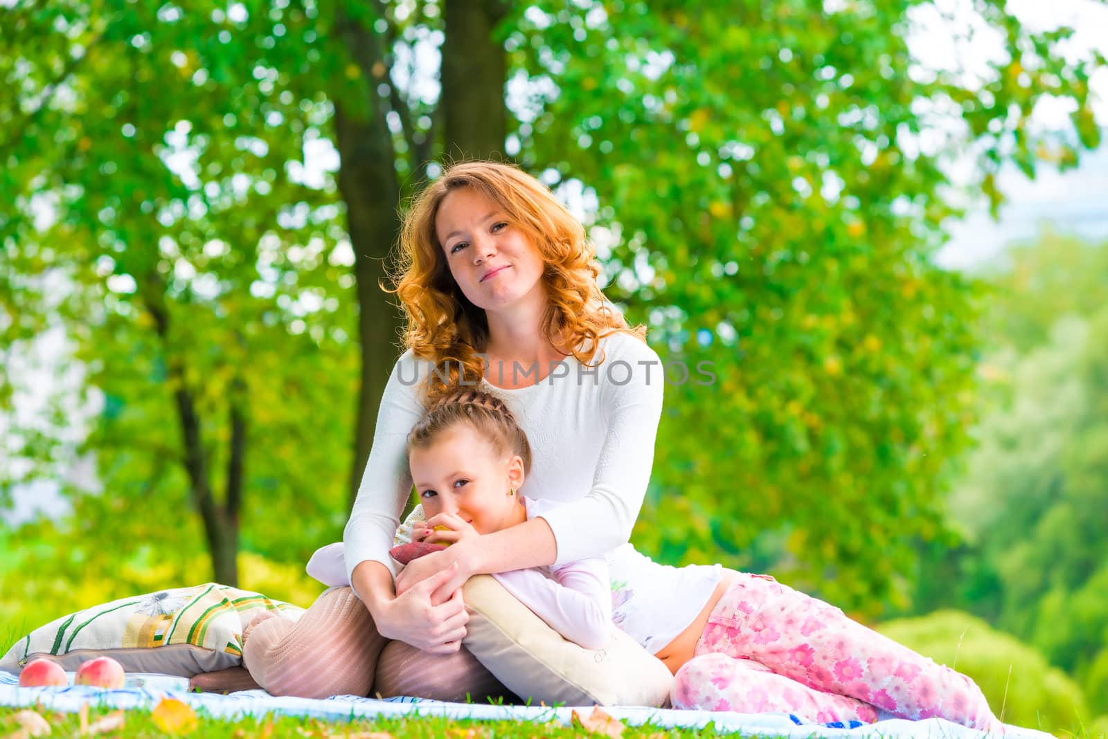 incomplete family posing in a park on a sunny summer day