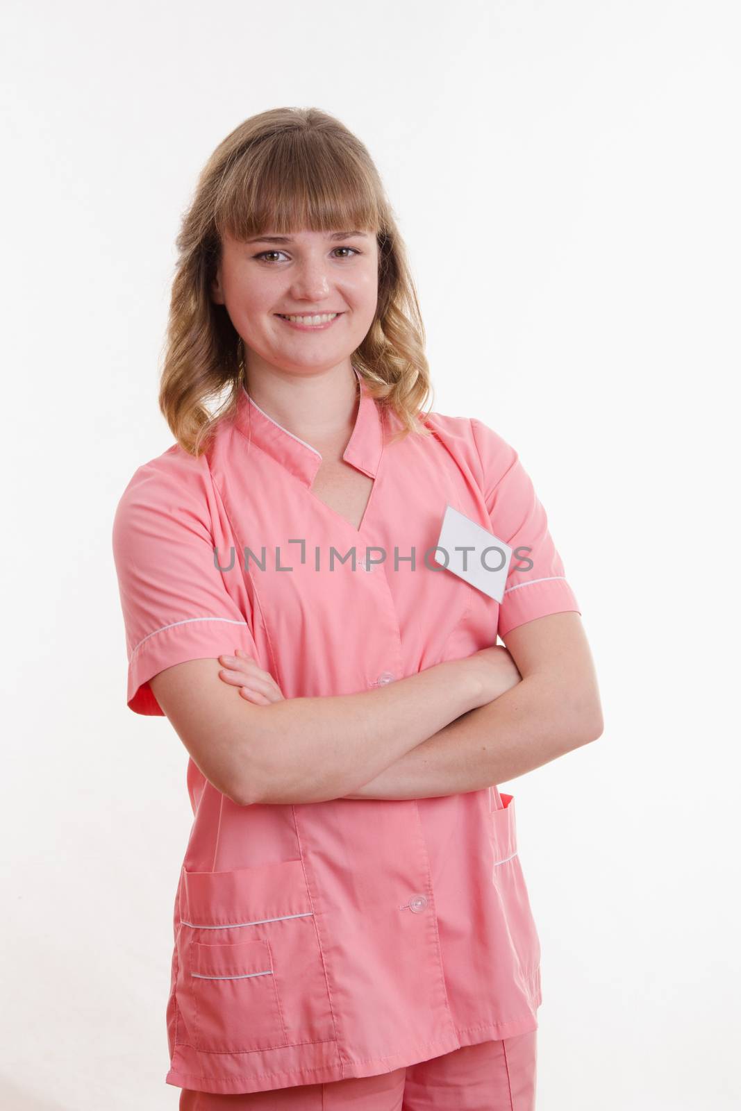 Portrait of a pretty girl medical worker on a white background