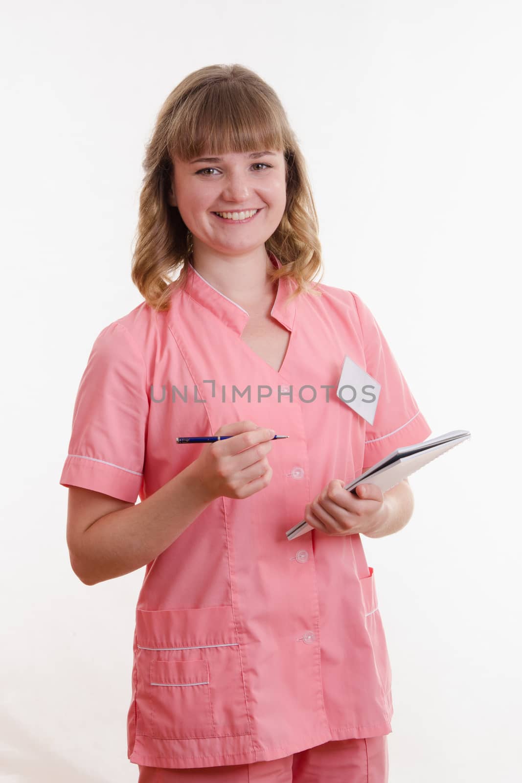 Portrait of a pretty girl medical worker on a white background
