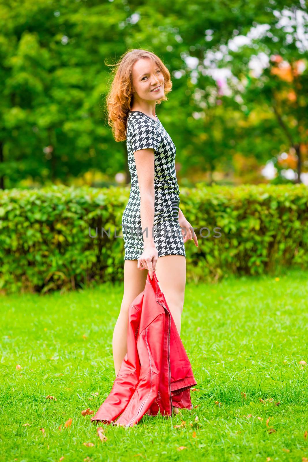 cheerful slim girl walking on the green summer park by kosmsos111