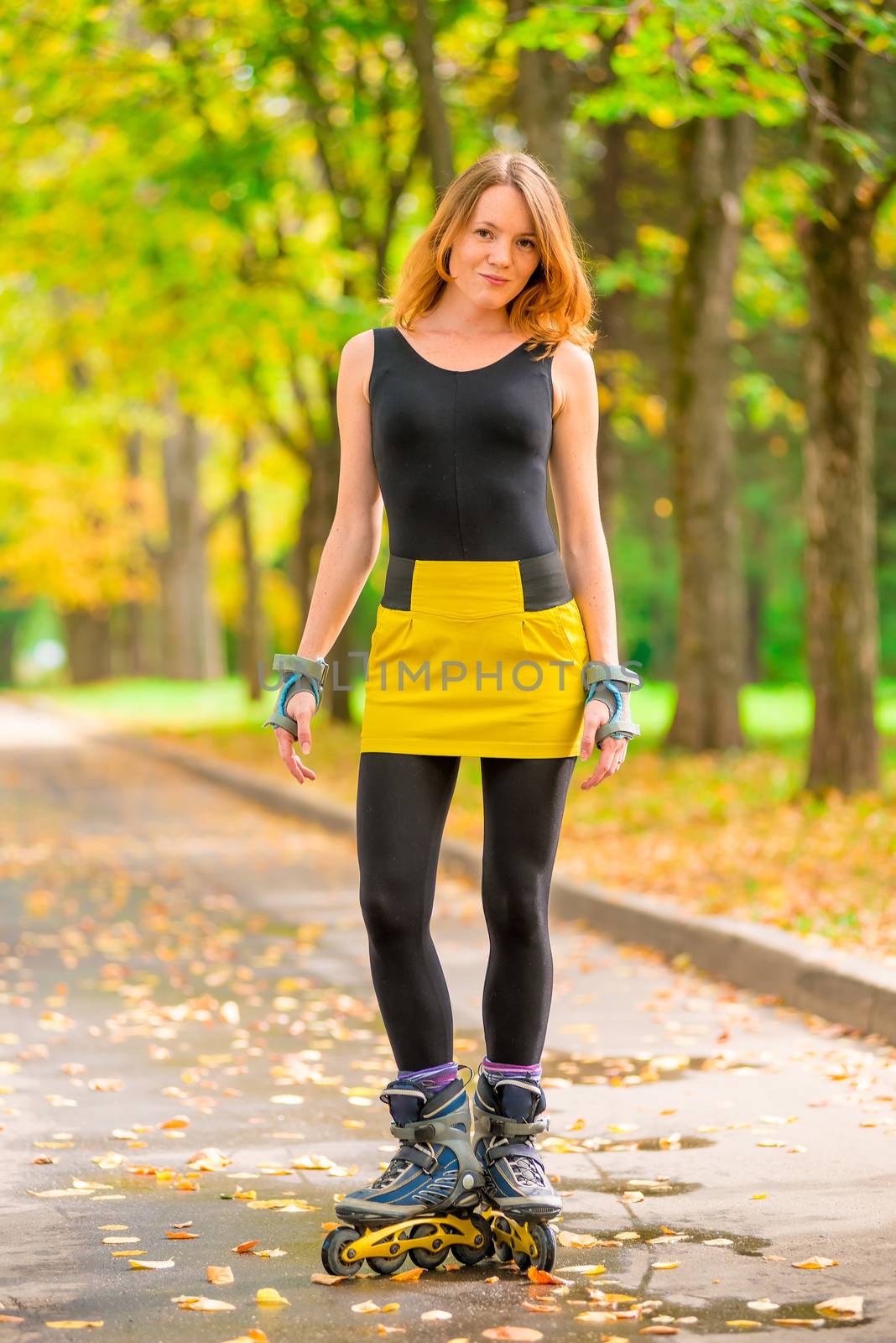 portrait of a girl in a yellow skirt roller skate