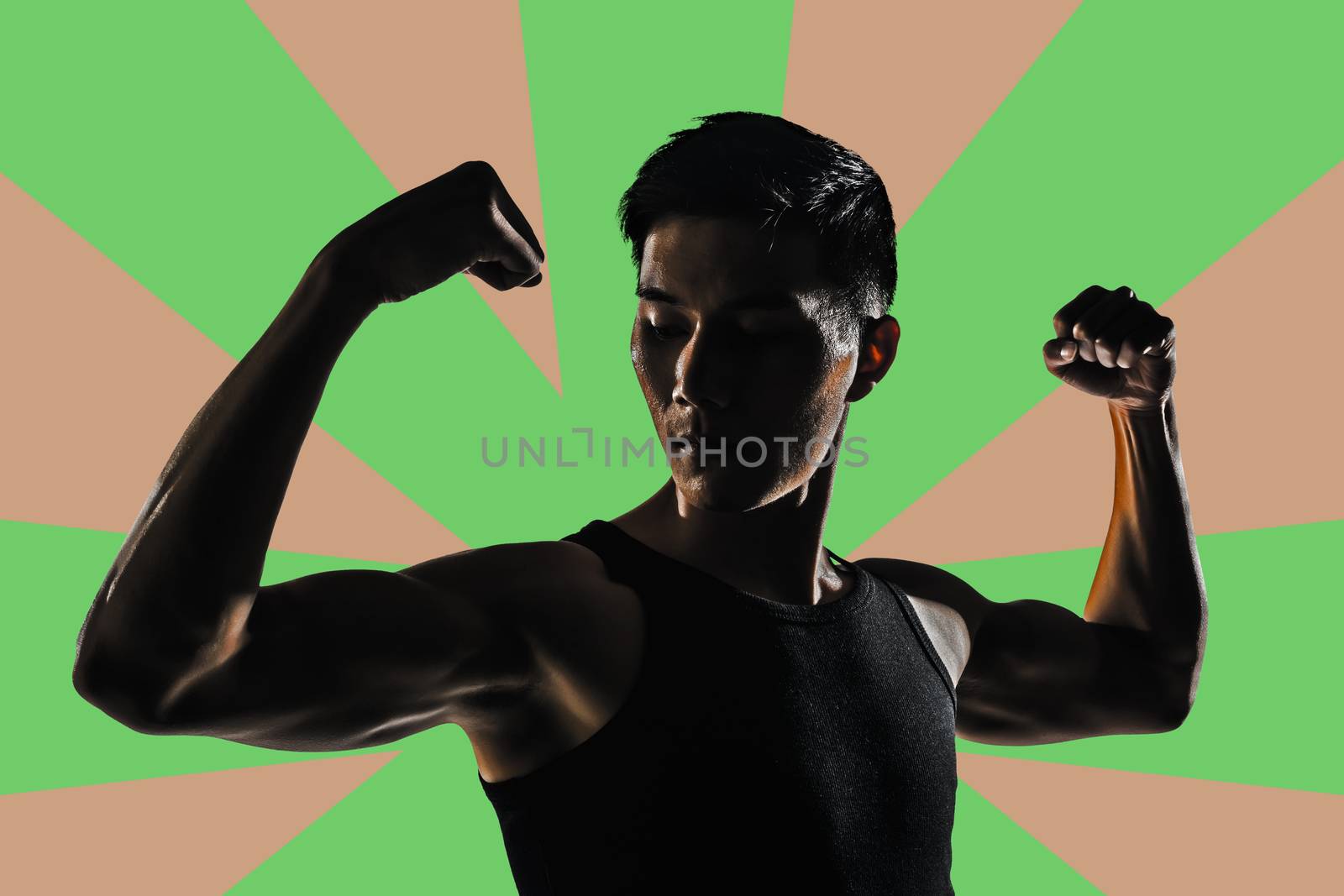 Silhouette of young man show his biceps brachii, closeup portrait.