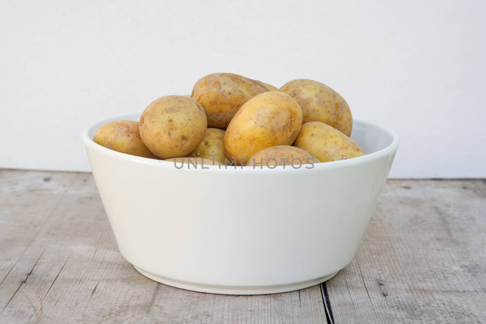 bowl with potatoes by courtyardpix