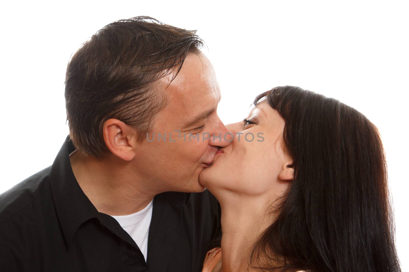 Two caucasian people kissing and being happy